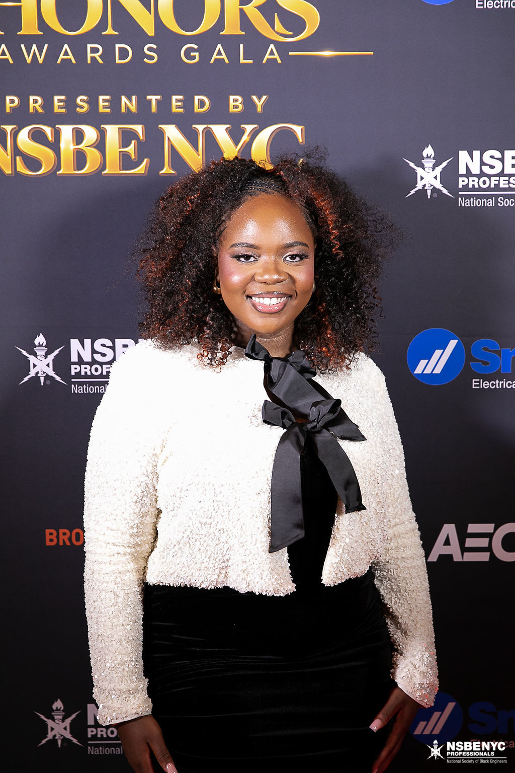 NSBE NYC professional photographed at the Black Tech Honors sponsor backdrop