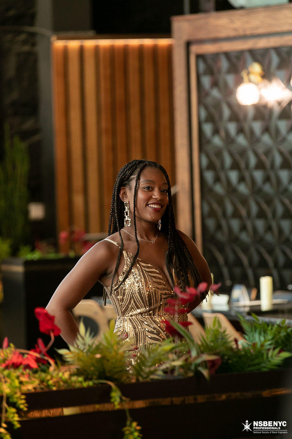 NSBE NYC gala attendee in a gold formal dress at the 2026 Black Tech Honors celebration
