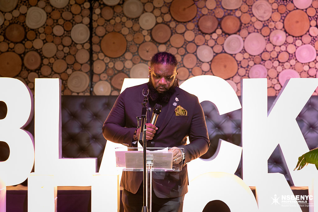 NSBE NYC leader presenting remarks during the 2026 gala program