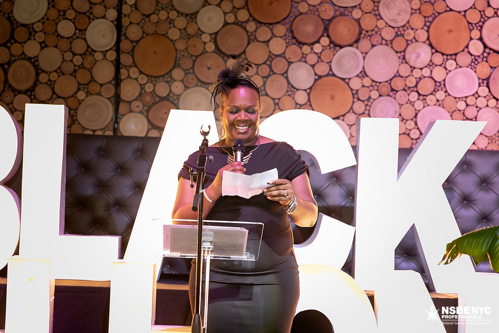 NSBE NYC representative speaking from the Black Tech Honors gala stage