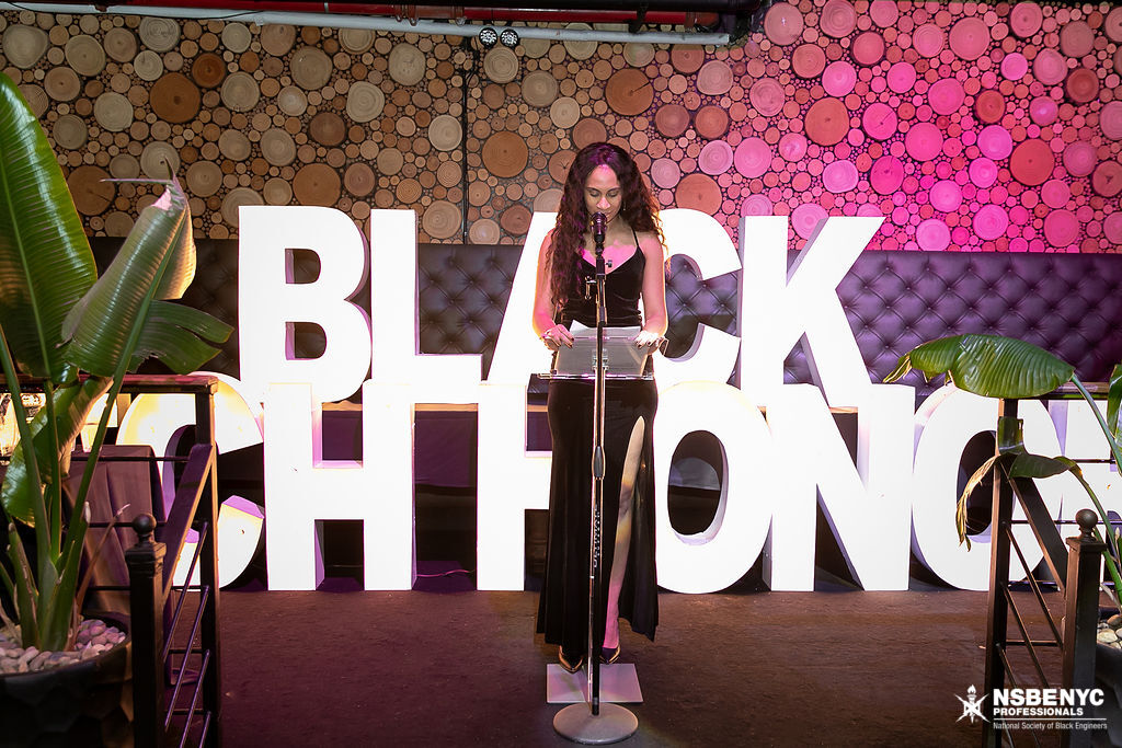 Gala speaker delivering remarks before the Black Tech Honors stage display